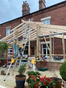 Rear extension and loft dormer with sliding patio doors on a brick semi-detached house